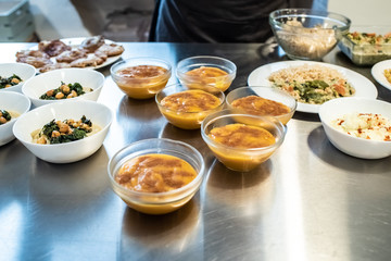 Cook plating their dishes and serving them hot and tasty.