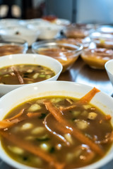 Hot bowls with vegan carrot soup.
