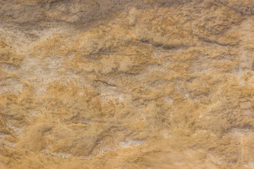 abstract yellow stone wall rock background texture wallpaper pattern concept photography, copy space