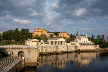 Philadelphia art museum area reflection in river during daytime with moody cloudy sky