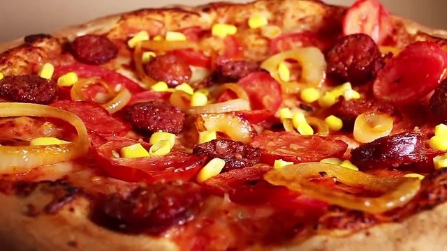 Home made pizza food closeup texture pattern seamless looping rotating video footage hd resolution.
