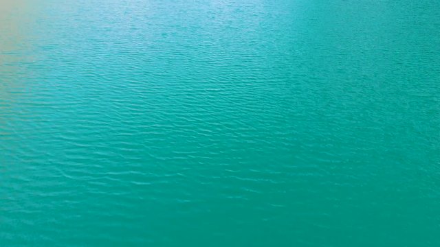 Drone flying above a beautiful blue lake in Loen Norway.