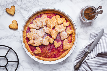 Raspberries jam pie with heart shape decorations