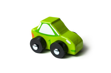 closeup of miniature wooden toy on white background - sport car concept