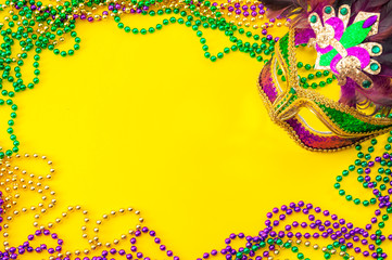 Fat Tuesday and Mardi Gras carnival concept theme with close up on a face mask full of color,...