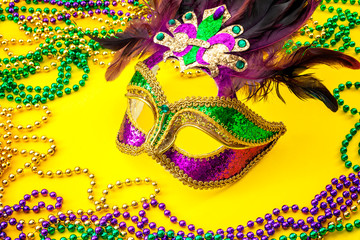 Fat Tuesday traditional accessory and Mardi Gras carnival concept theme with close up on a face...