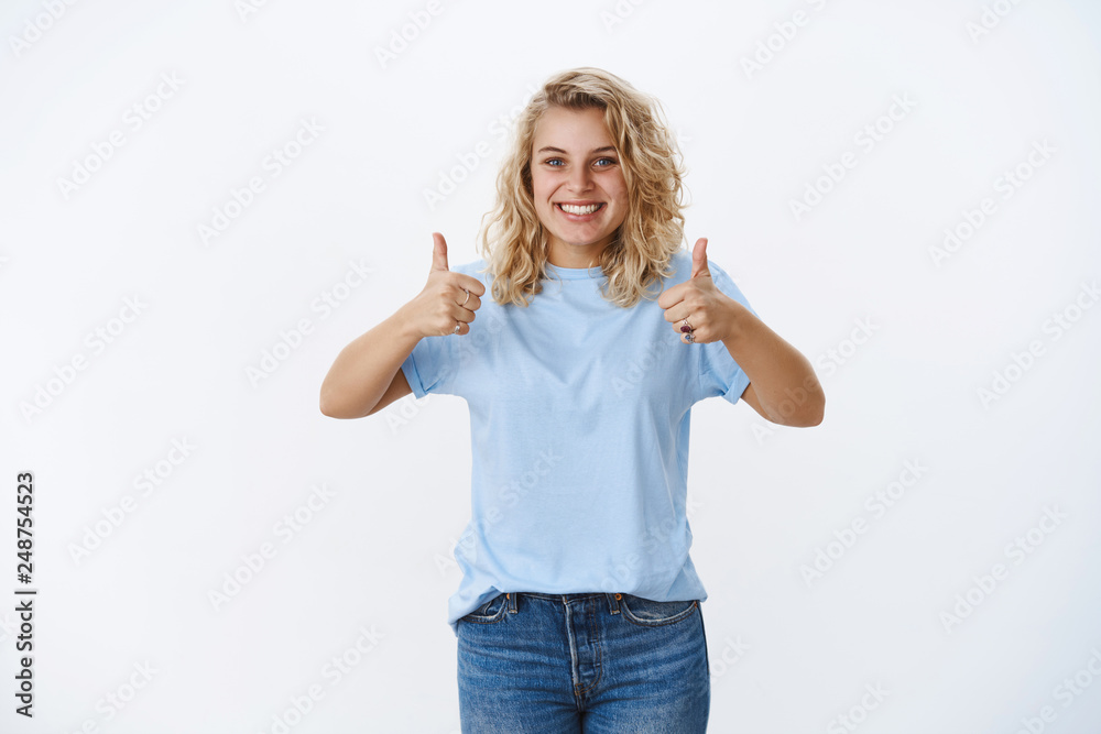 Canvas Prints Good job. Portrait of optistic and supportive charming cute blond girlfriend with blue eyes smiling nice and cute as cheer up friend showing thumbs up gesture in approval and like gesture