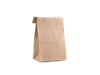 Paper brown bag for goods. Isolate. Studio photography