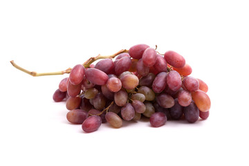 A bunch of ripe pink grapes. Isolate. Studio photography