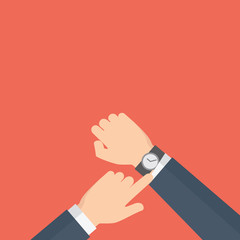 Man with clock checks the time. A hand showing a time