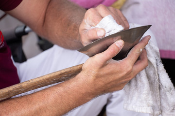 Obraz premium polishing an axe for a wood chop