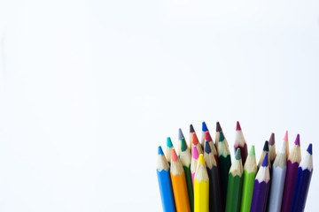 Color pencils isolated on white background, with copy space for text.