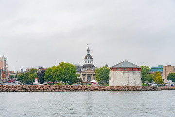 Shoal Tower by the harbor with the city hall