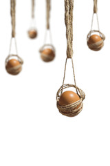 Eggs hanging on the rope. Selective focus. Hanged Easter eggs isolated on white background