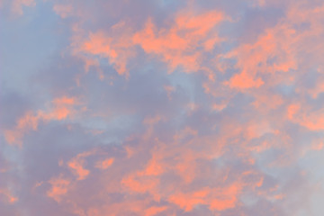 Colorful with red, orange and blue dramatic sky on the clouds for abstract background. Romantic sunset background with beautiful blue, red and yellow clouds.