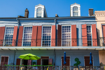 Traditional French Quarter Building with Red Shutters Looks over Jackson Square in New Orleans, Louisiana, USA
