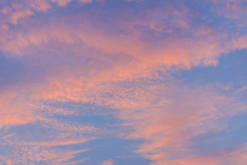 Naklejka na ściany i meble Colorful with red, orange and blue dramatic sky on the clouds for abstract background. Romantic sunset background with beautiful blue, red and yellow clouds.