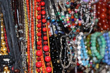 Bead necklace or rosary, threading from a rounded small piece of stone and silver material.