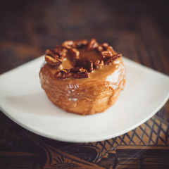 Walnut Maple Cronut on a white plate