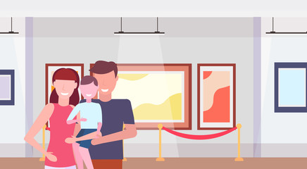 family visitors in modern art gallery museum interior parents with little son looking contemporary paintings artworks or exhibits flat horizontal portrait