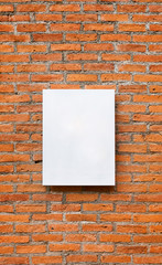 Blank white board on red brick wall background