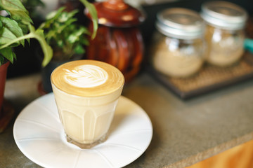 Cup of coffee with latte art pattern milk foam