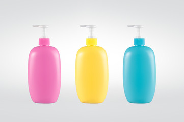 Multicolored plastic dispenser bottles isolated on background. Clipping path