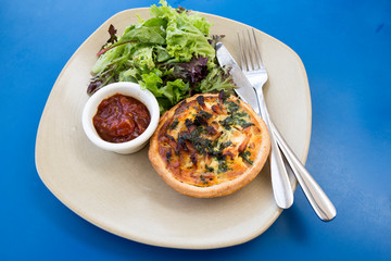 Quiche with vegetables and sauce