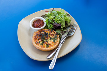 Quiche with vegetables and sauce