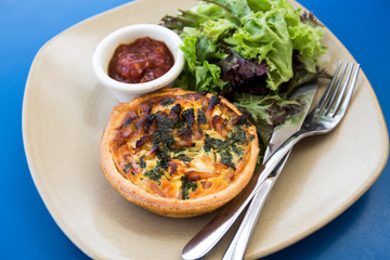 Quiche with vegetables and sauce