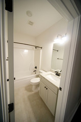 Fototapeta na wymiar Guest Bathroom in a New Construction House
