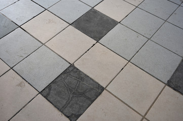 Dirty Tile with Broken Pieces and Patch