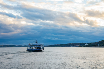 Sunset view of the Quebec city skyline with Fairmont Le Château Frontenac, ferry