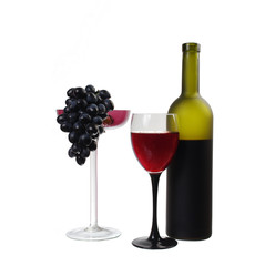 A glass of red wine, grapes and bottle on white