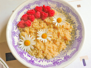 Bowl of oatmeal porridge with fresh strawberries and raspberries.Healthy breakfast. Flat lay, top view, copy space. Morning healthy breakfast.Close up. Healthy food, healthy breakfast concept.
