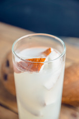 Sweet coconut cocktail on the wooden background. Selective focus. Shallow depth of field.