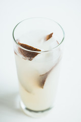 Sweet coconut cocktail on the wooden background. Selective focus. Shallow depth of field.
