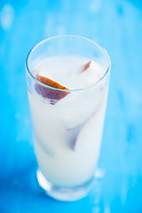 Sweet coconut cocktail on the wooden background. Selective focus. Shallow depth of field.