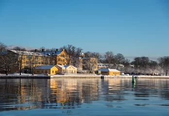 Deurstickers A cold winter  day in Stockholm with snow and ice on islands and boats © Hans Baath