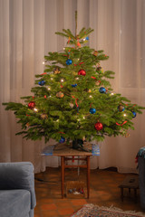 Fototapeta na wymiar Goxwiller, France - 12 22 2018: Christmas tree with decorations