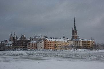Winter view over the Riddarholmen island a gray and snowy winter day