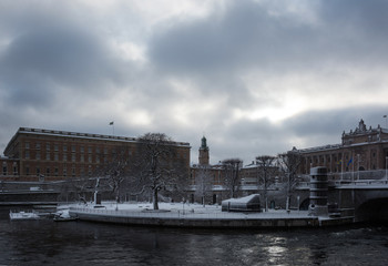 Fototapeta premium Government buildings and castle a gray snowy winter day in stockholm