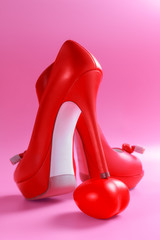 Concept about love and relationship.  Love heart under the heel. Henpecked. Couple In love. Romantic and love. Intimate relationship and sexual relations. Dominant woman. Seduction.