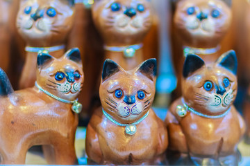 Cute collection of wooden cats, handicraft souvenir from Thailand.