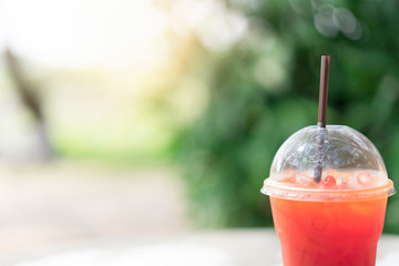 Iced tea with plastic glass with tube.  Drink concept