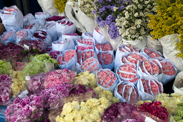 Bangkok Thailand, bunches of flowers wrapped in paper at the pak khlong talat flower market