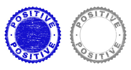 Grunge POSITIVE watermarks isolated on a white background. Rosette seals with grunge texture in blue and gray colors. Vector rubber stamp imitation of POSITIVE text inside round rosette.