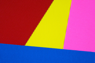 Multi coloured corrugated paper texture, use for background. vivid colour with empty space for add text or object.