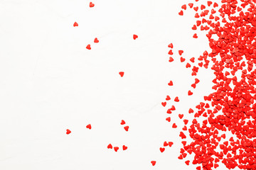 Fototapeta na wymiar Sweet red hearts on white background - Valentine's Day or love concept, flat lay with place for text, top view