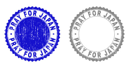 Grunge PRAY FOR JAPAN stamp seals isolated on a white background. Rosette seals with distress texture in blue and gray colors.